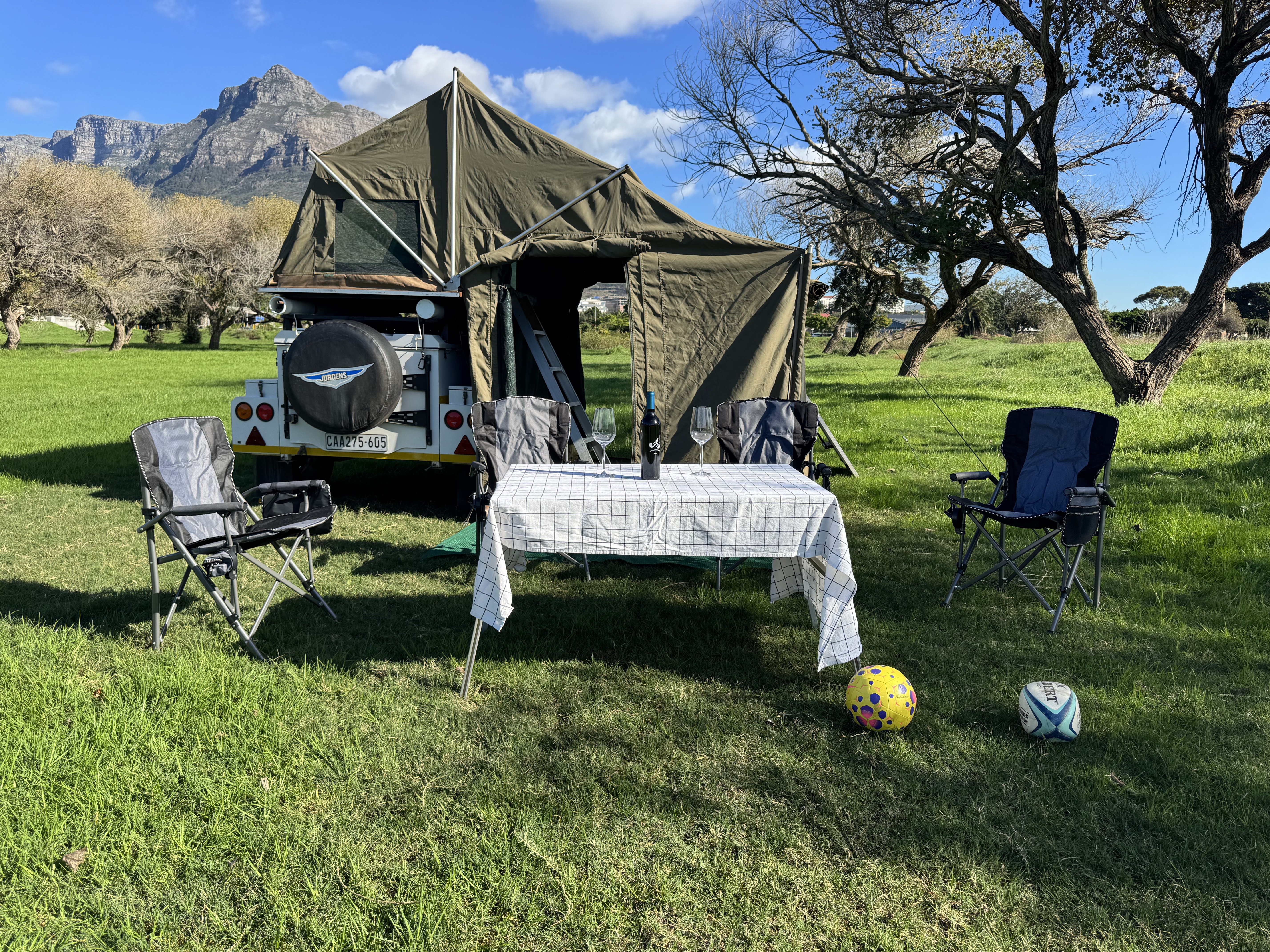 Sleek off-road camper trailer camped under sunset golden hour in the Cederberg Mountains, South Africa